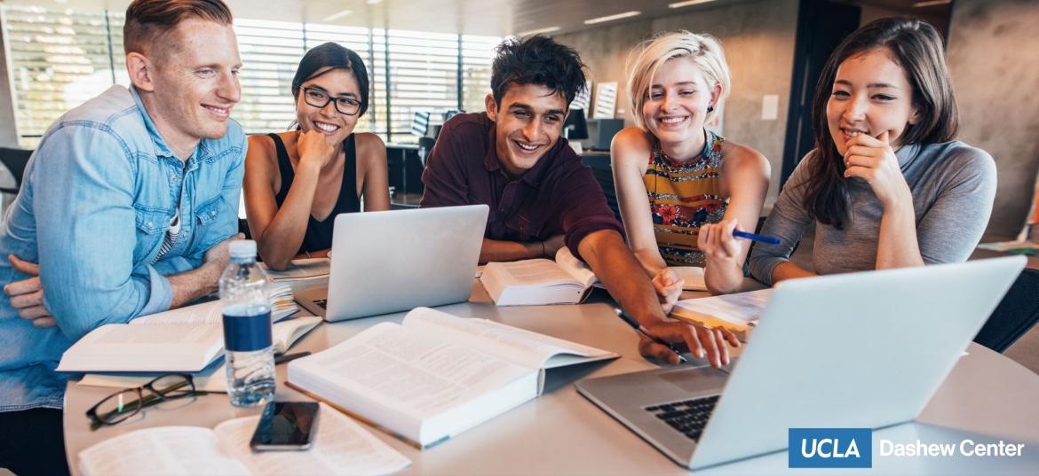 students in table smiling 