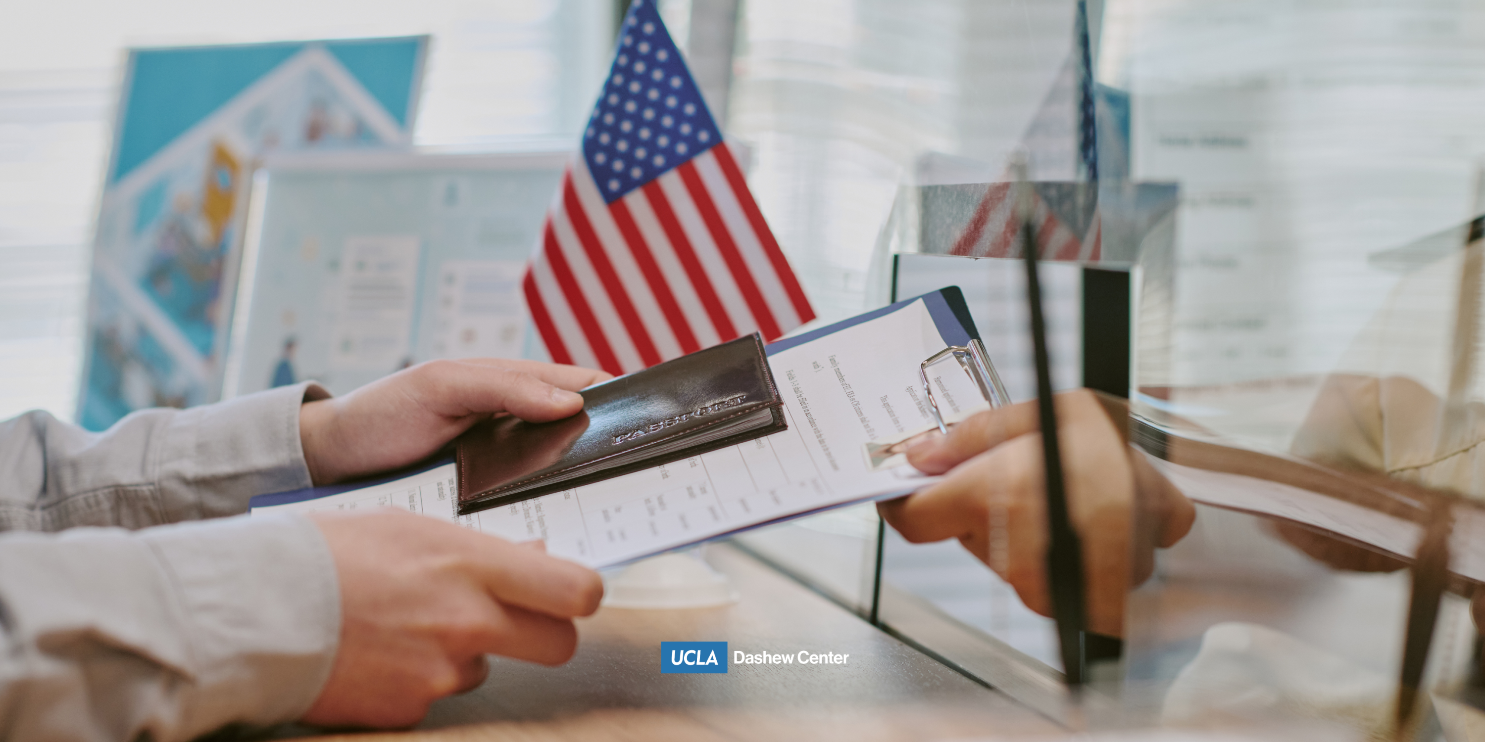 a person exchanging documents and the american flag